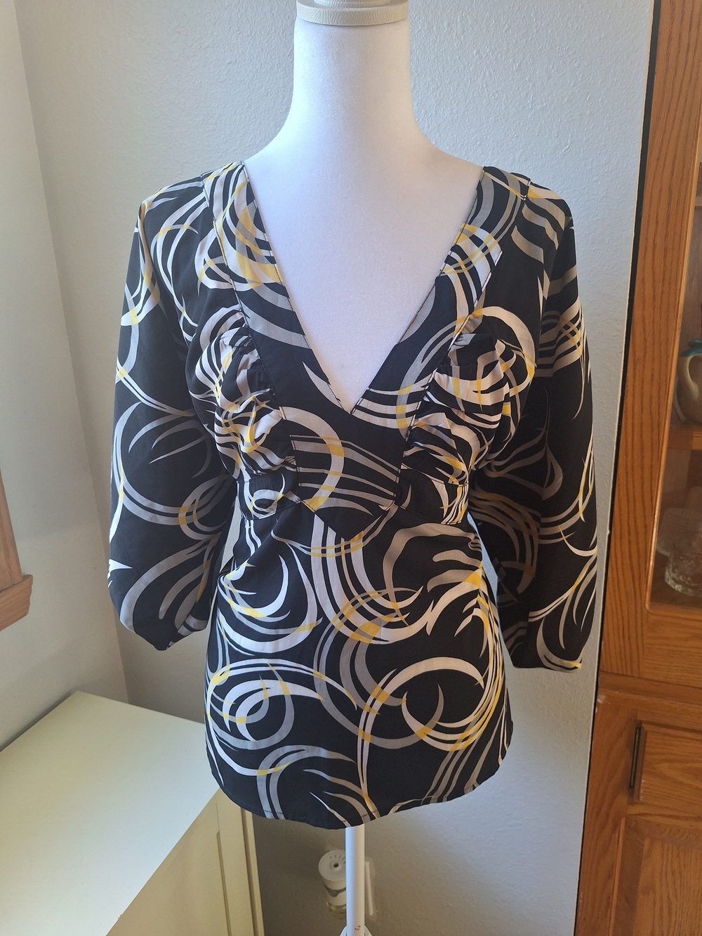 Y2K Black V-Neck Women’s Blouse with Yellow and Cream Swirl Print